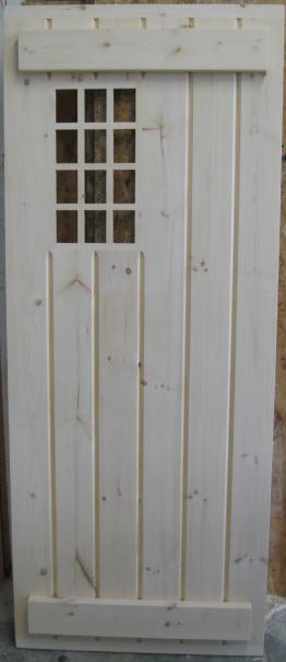 Pine stockade door with off-set 12 lite window