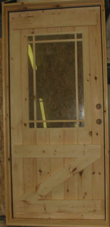 Exterior stockade door with crossbuck and praire grill