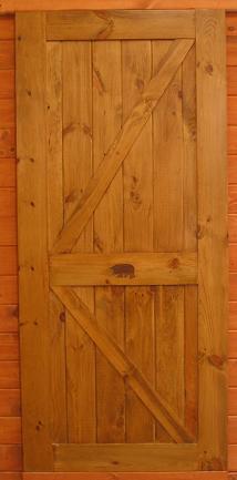 rustic cross buck door with carving