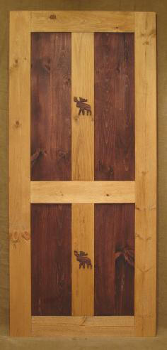 Interior wood door with rustic moose carving