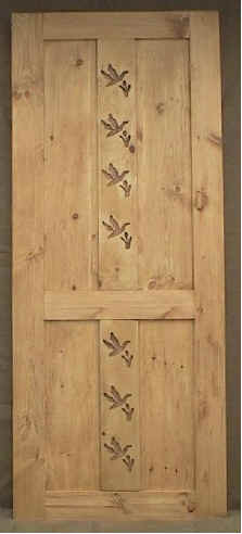 Rustic door with duck carving