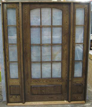 Arched glass door with sidelights
