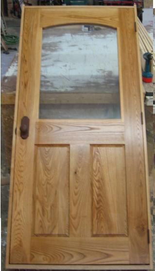 Arched glass hardwood door