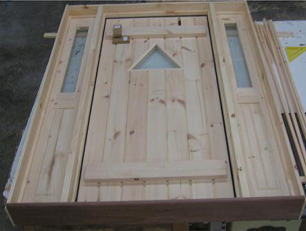 Custom pine door with triangle glass and half glass sidelights
