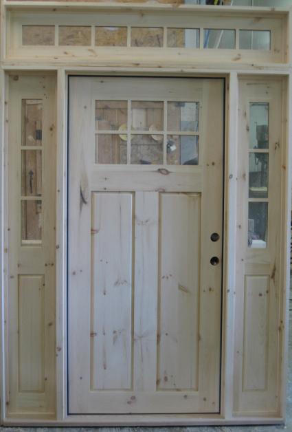 Exterior door with sidelights and transom