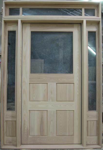 Hardwood rustic door with sidelights and transom