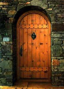 Arch door with acorn hardware
