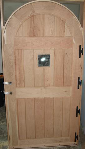 frame and panel arch top exterior door