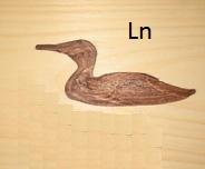 A carving of a loon