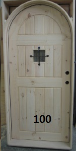 Frame and panel arch top door with iron grill