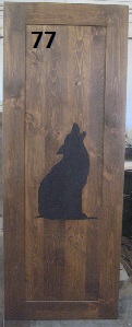 Wolf carving on interior pine door