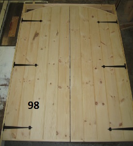 Double exterior stockade arch top door